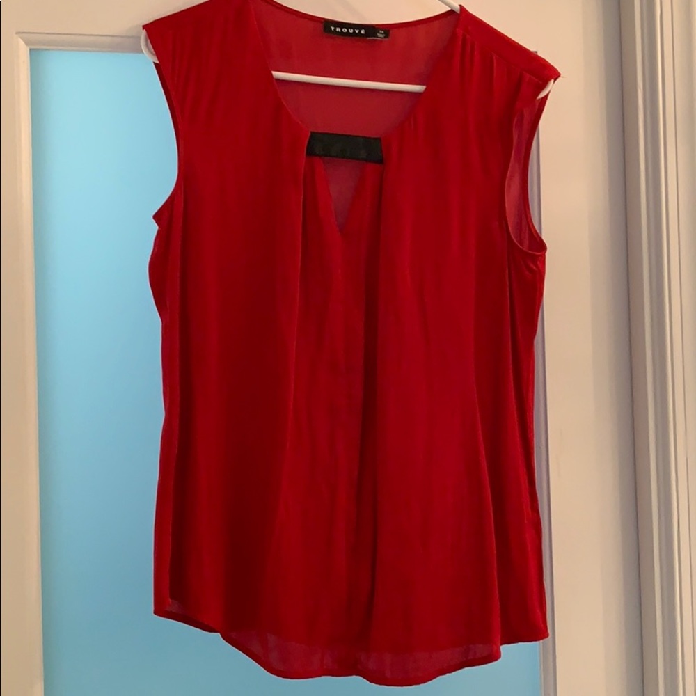 Red sleeveless top.